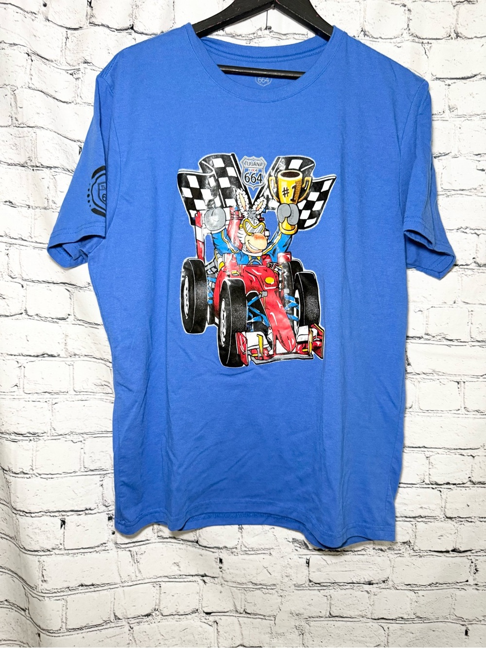 664. Blue graphic Tshirt. Size M
